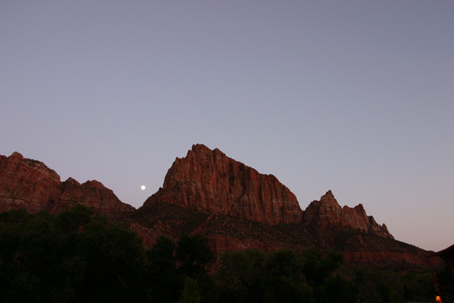 the moon setting over Zion National Park